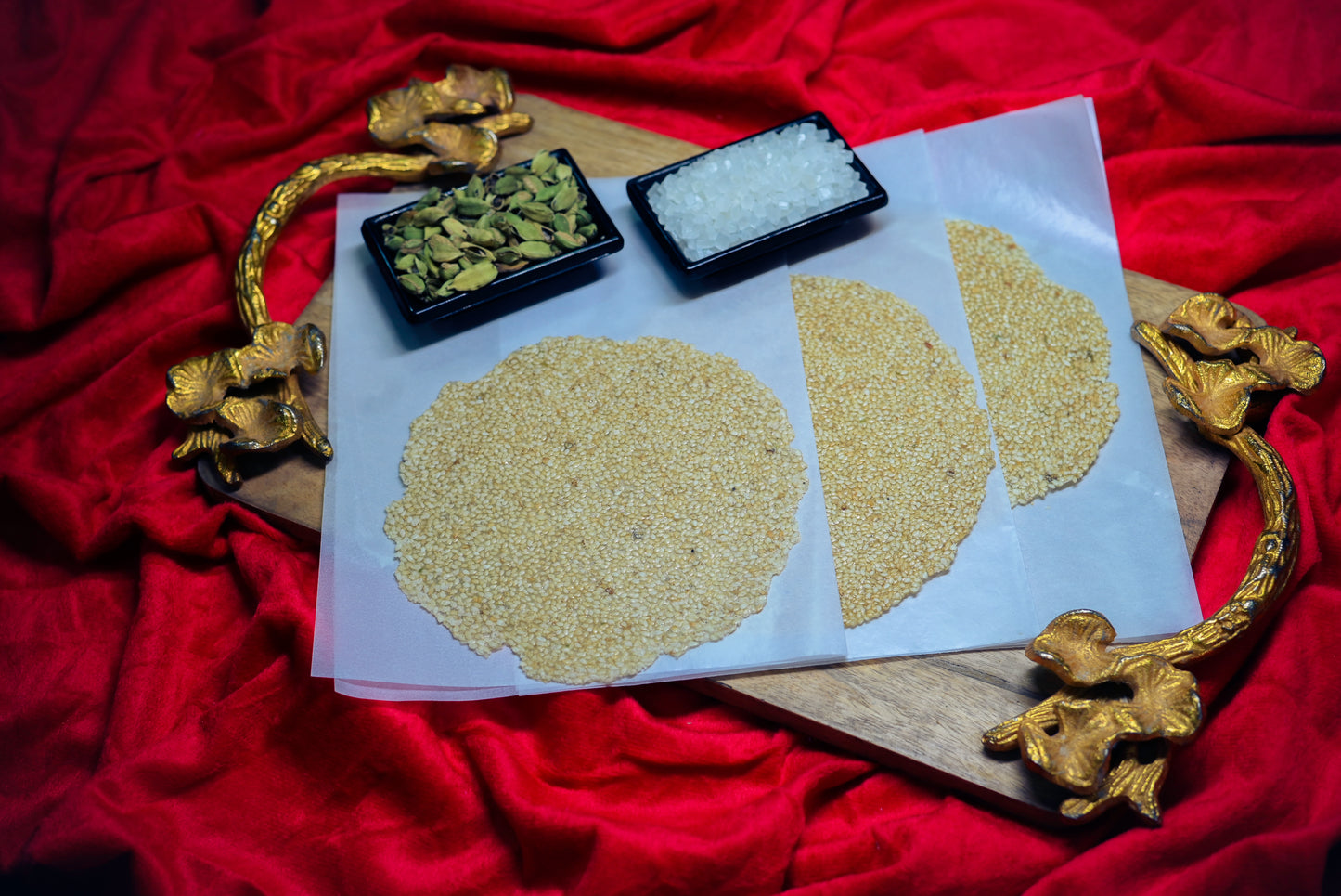 Cardamom Tilpatti round sesame sweet with packaging tub