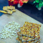 Crispy peanut jaggery chikki stacked on blue cloth