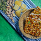 Crispy peanut jaggery chikki stacked on blue cloth