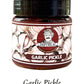 A jar of Garlic Pickle with a label that features an illustration of garlic and spices, and the text 'GARLIC PICKLE' at the bottom.