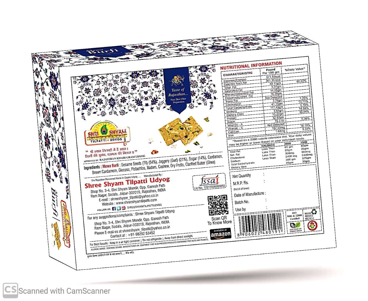 A packaged Mewabarfi Indian sweet treat, with a luxurious blend of nuts, creamy milk, and aromatic cardamom. The packaging is designed with floral patterns and product details.