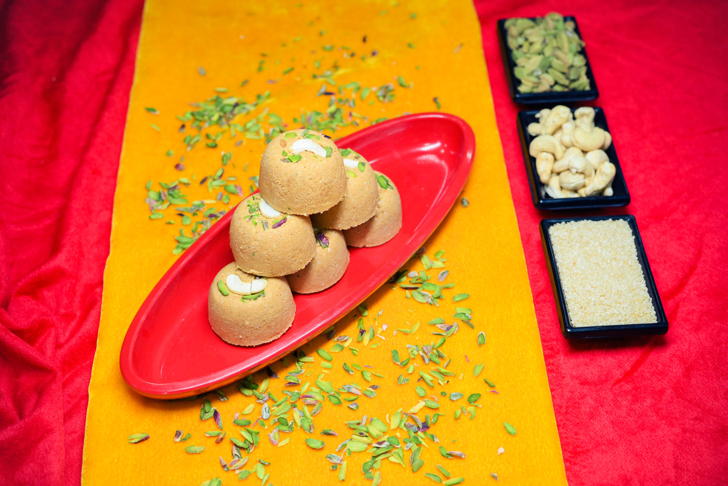 Traditional Mewabati mithai arranged on decorative festive background