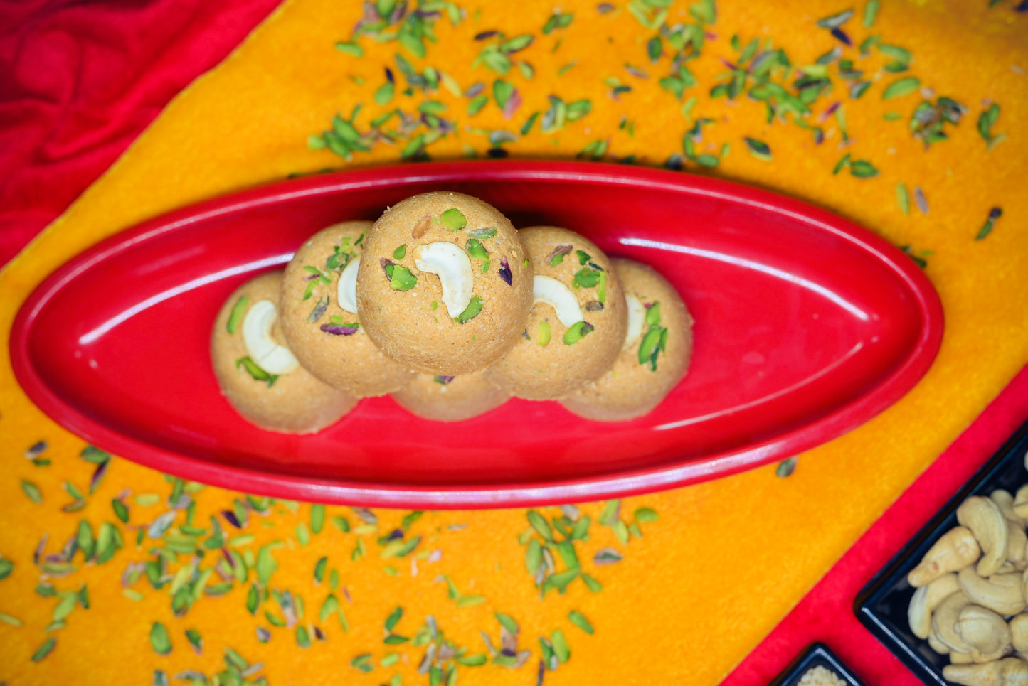Traditional Mewabati mithai arranged on decorative festive background