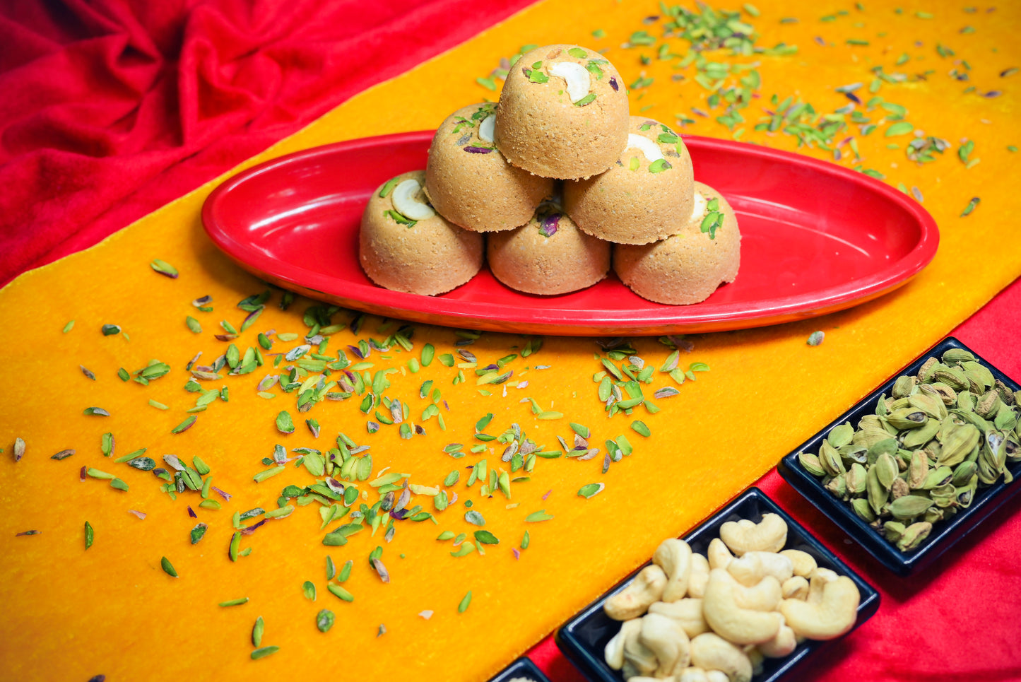 Traditional Mewabati mithai arranged on decorative festive background
