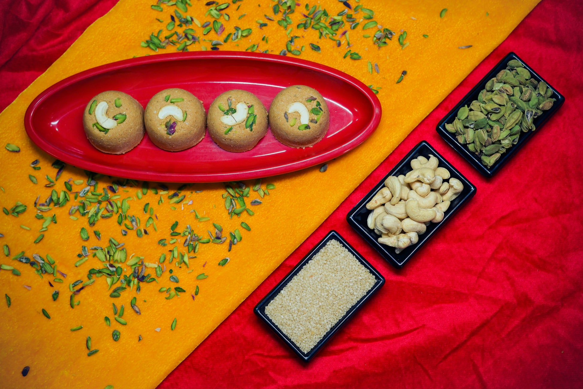 Traditional Mewabati mithai arranged on decorative festive background
