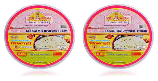 Two packages of Special Mixed Dry Fruit Tilpatti by Shree Sai, with branding and graphics depicting the product as a festive treat with cardamom and jaggery.