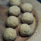 Nutty Til Laddu arranged on wooden plate – Authentic Indian sweet