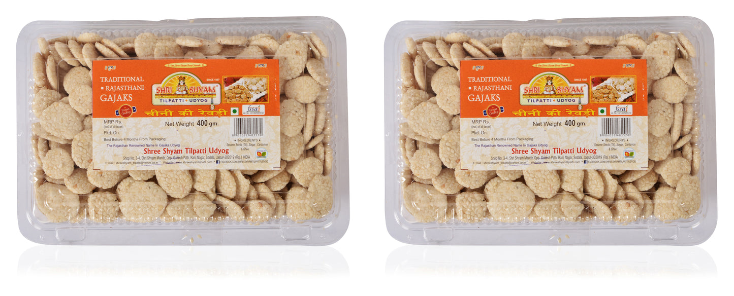 Three packages of Sugar Rewdi sweet traditional delights, with visible pieces of the snack inside the packaging.