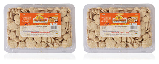 Three packages of Sugar Rewdi sweet traditional delights, with visible pieces of the snack inside the packaging.